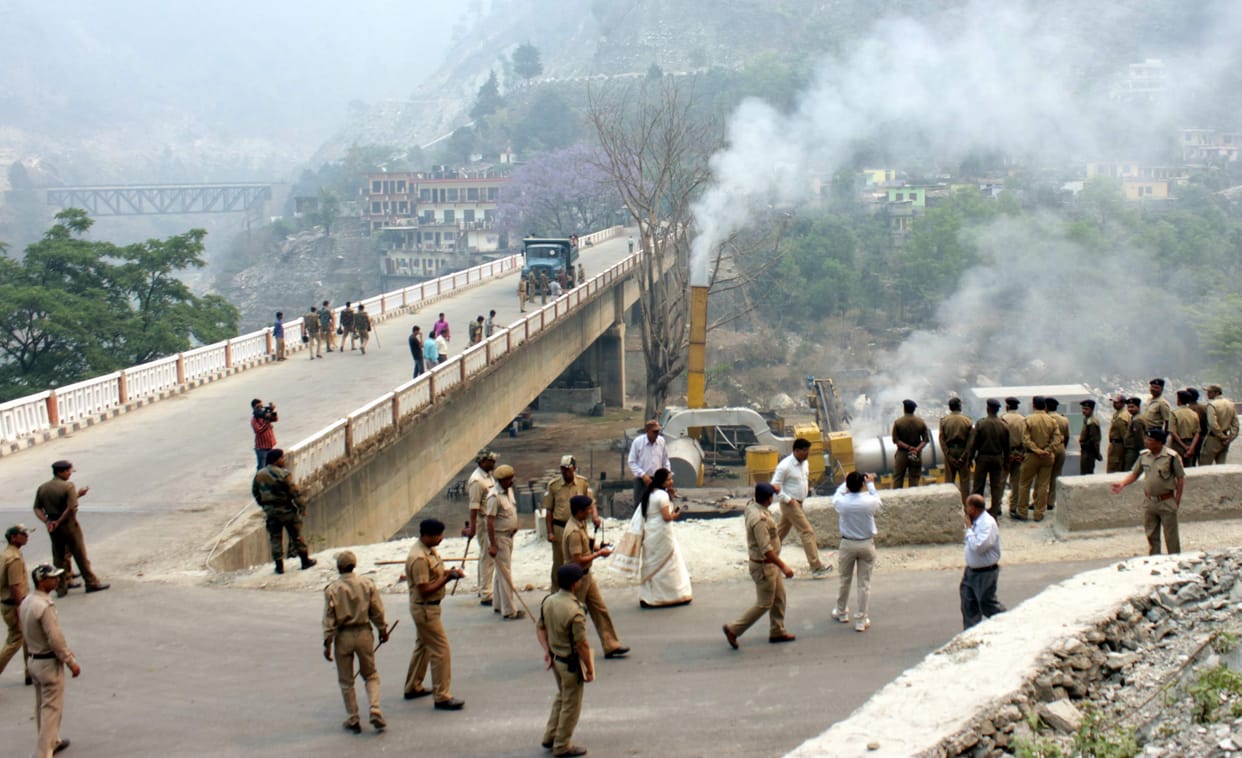 Police guard the hot mix plant start