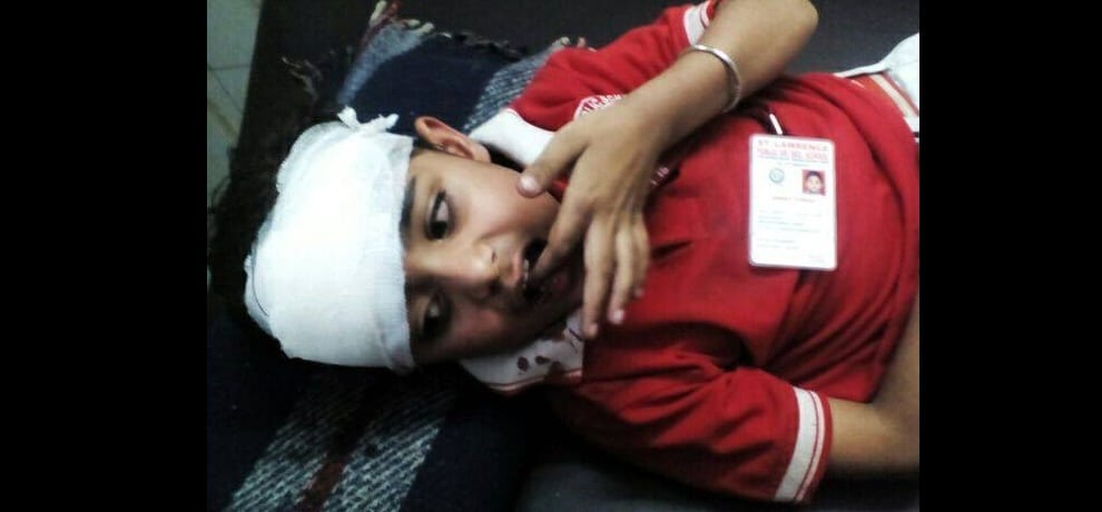 school boy falls from window of running school bus