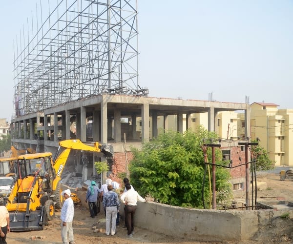 Building demolition in Jiyamau.