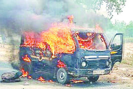 Burnt car on highway