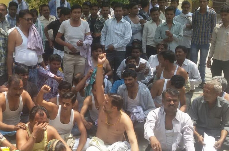 Sat naked in a state employment minister