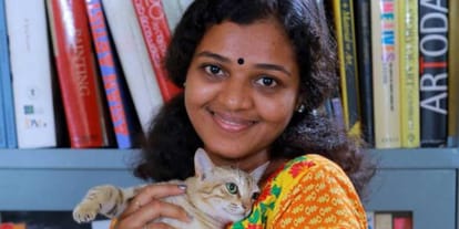 Kerela based woman applies black paint on face