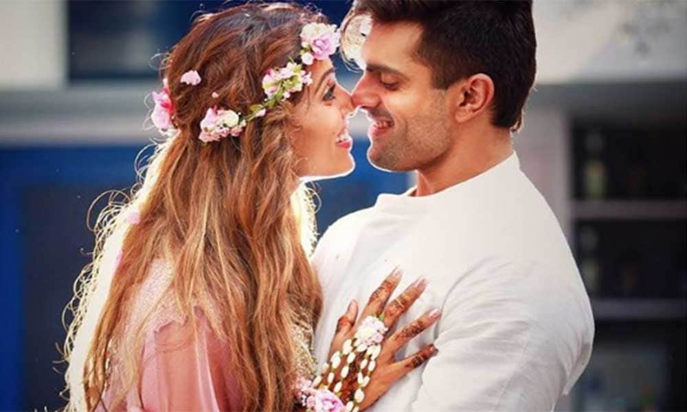 Bipasha Basu Karan Singh Grover celebrating 3rd wedding anniversary with cake and Kisses