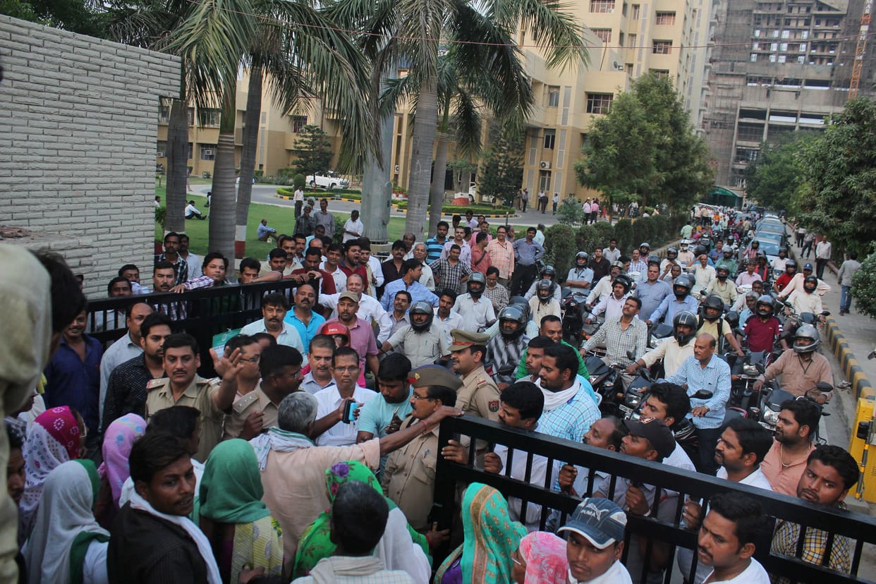 farmers take hostage of lda workers for compensation