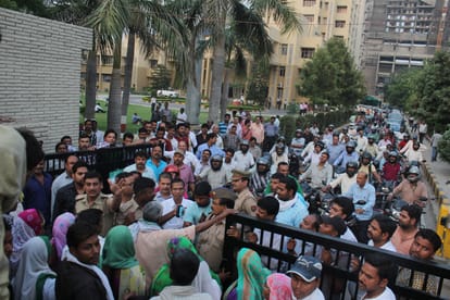 farmers take hostage of lda workers for compensation