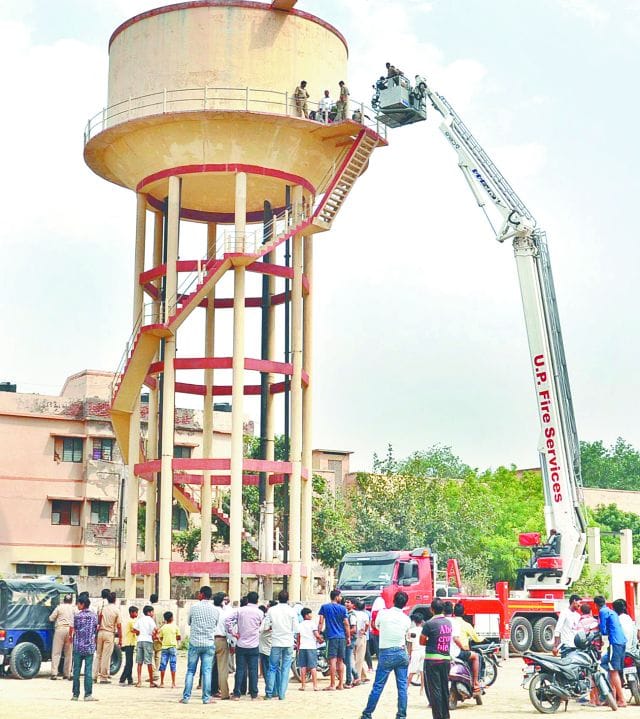 angry women stand top on water tank