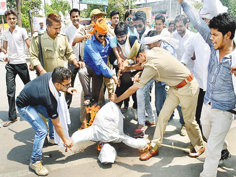 Effigies of police scrambling