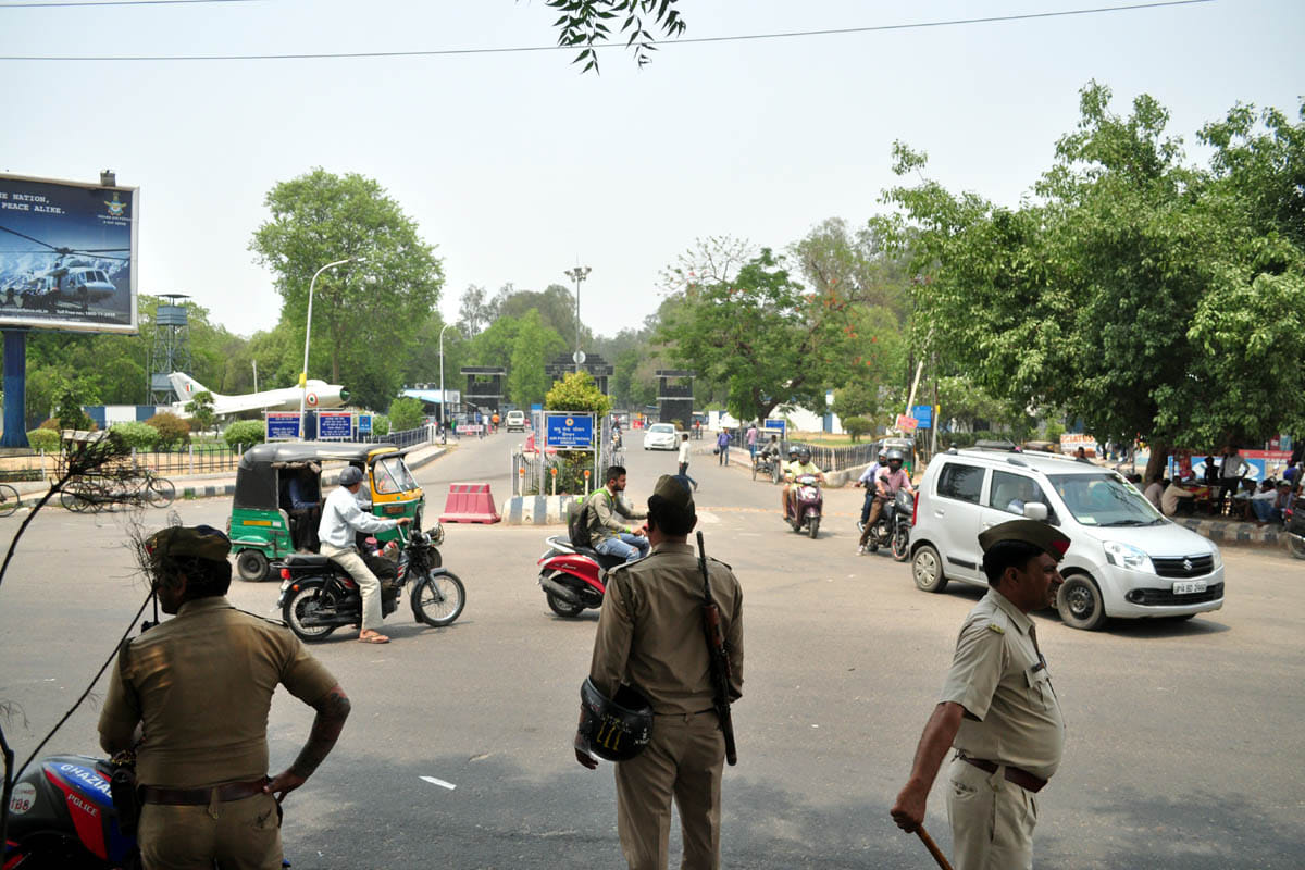 Police raised the security gate outside the airbase
