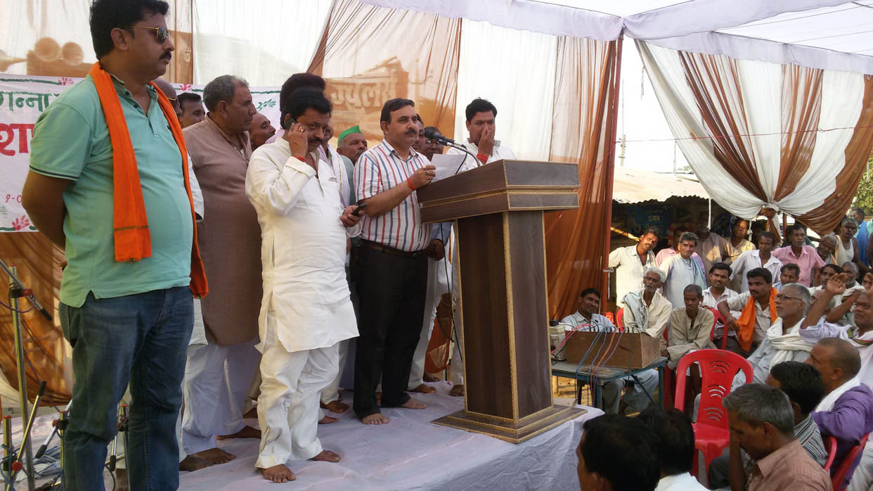 MLA with farmers picketed