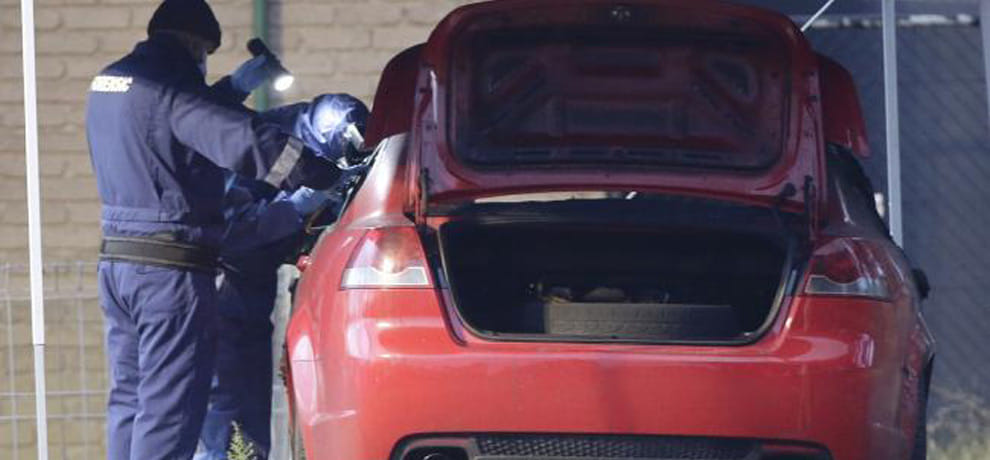 The body of the woman in the car kept moving by businessmen