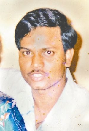 man murder in front of police station