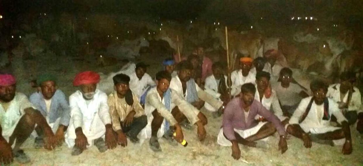 Villagers herd of cows hoop