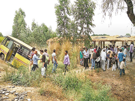 Truck collided with a school bus falls into ravine , five injured