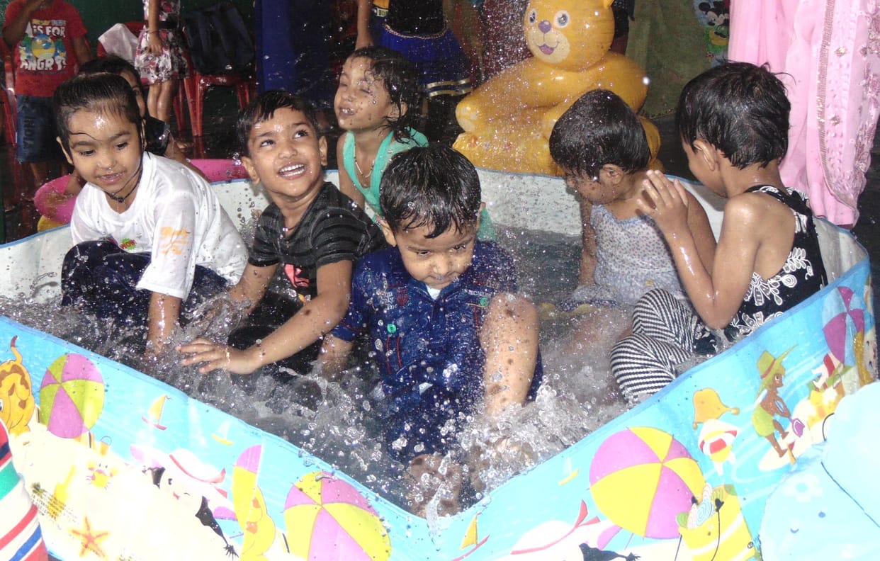 children entertain with water play
