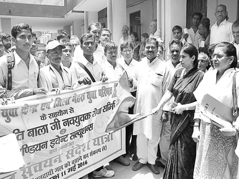 N Wi volunteers traveling extracted water harvesting message