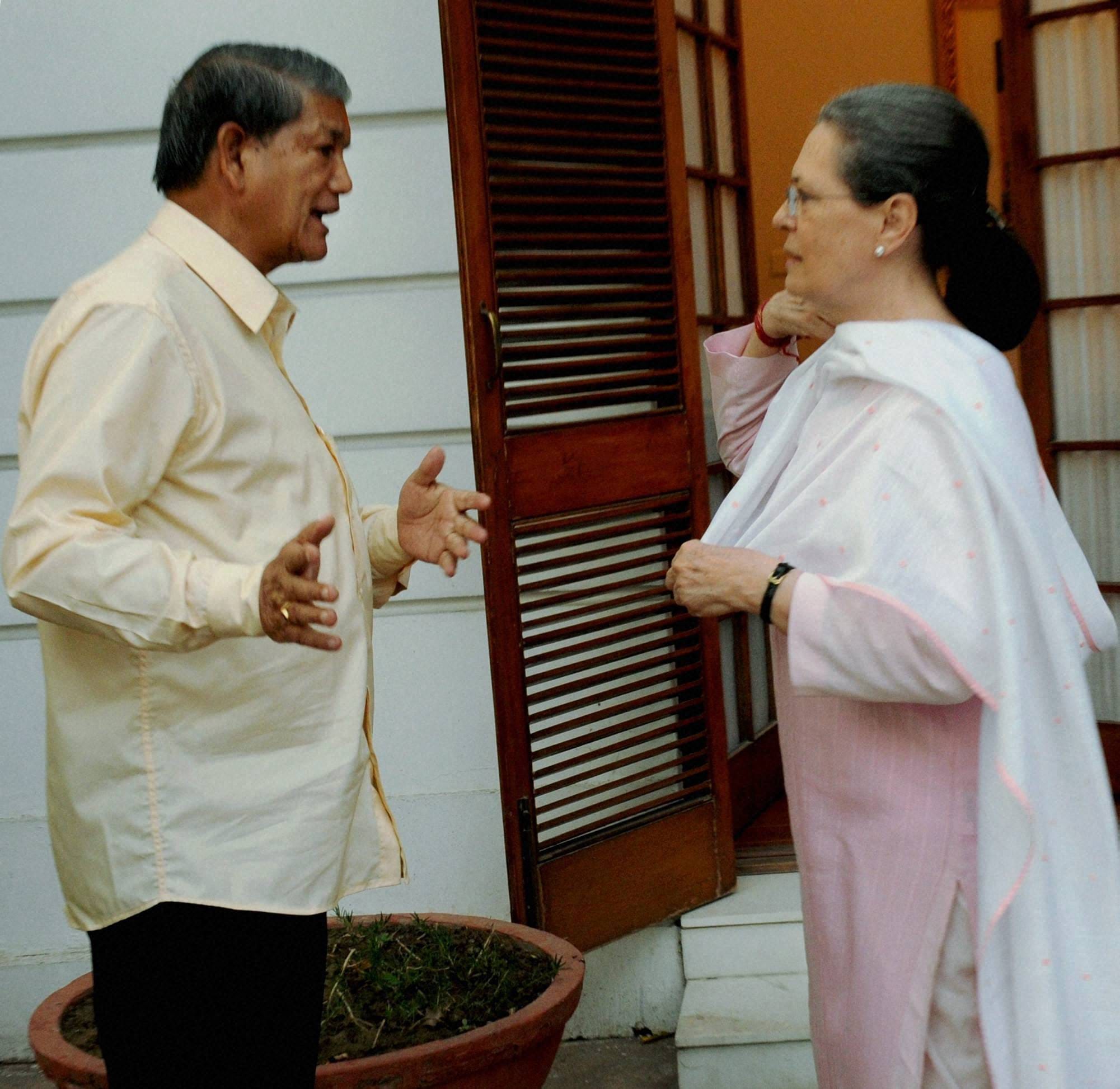 harish rawat met sonia gandhi after winning floor test.