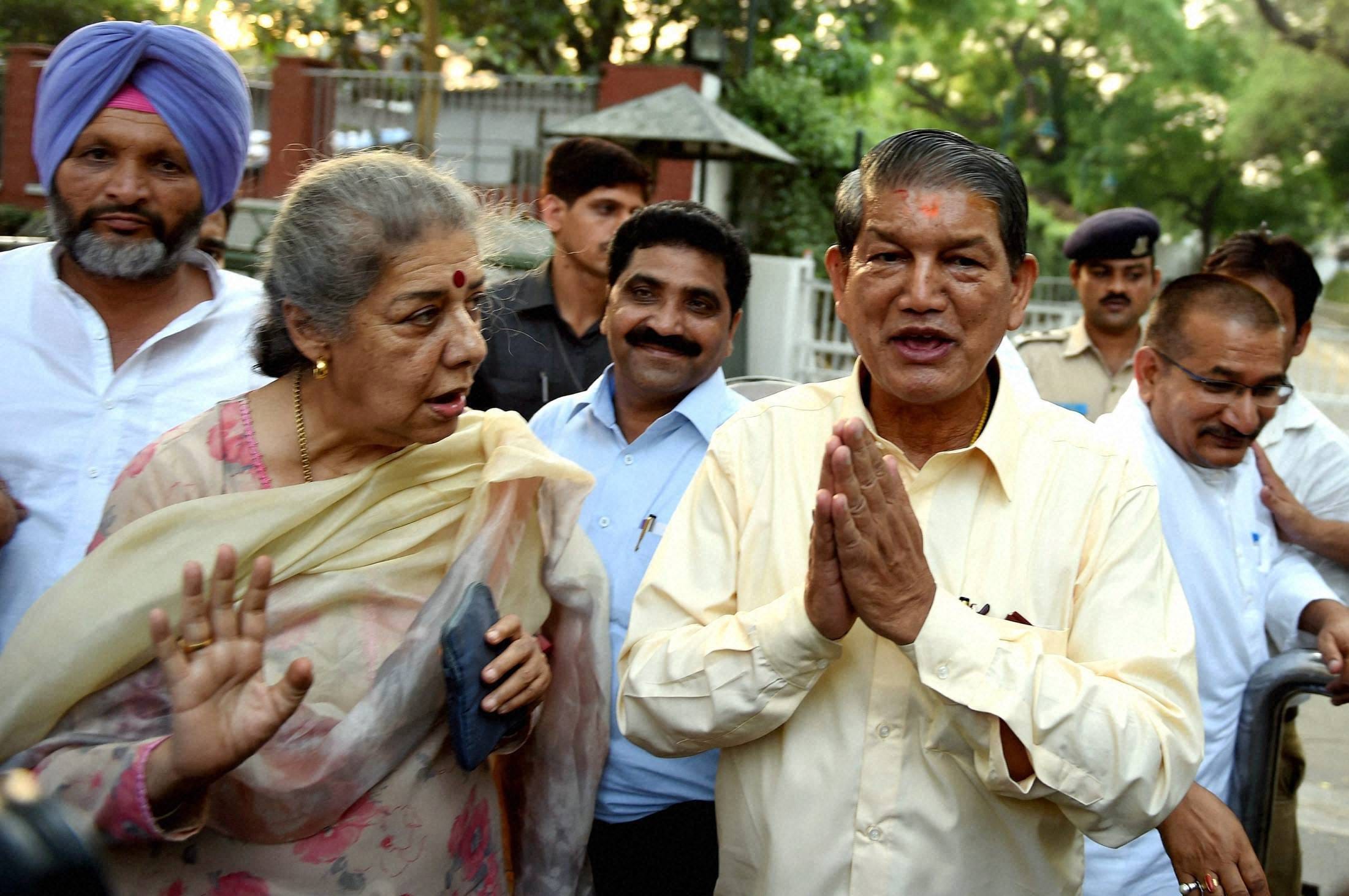 harish rawat met sonia gandhi after winning floor test.