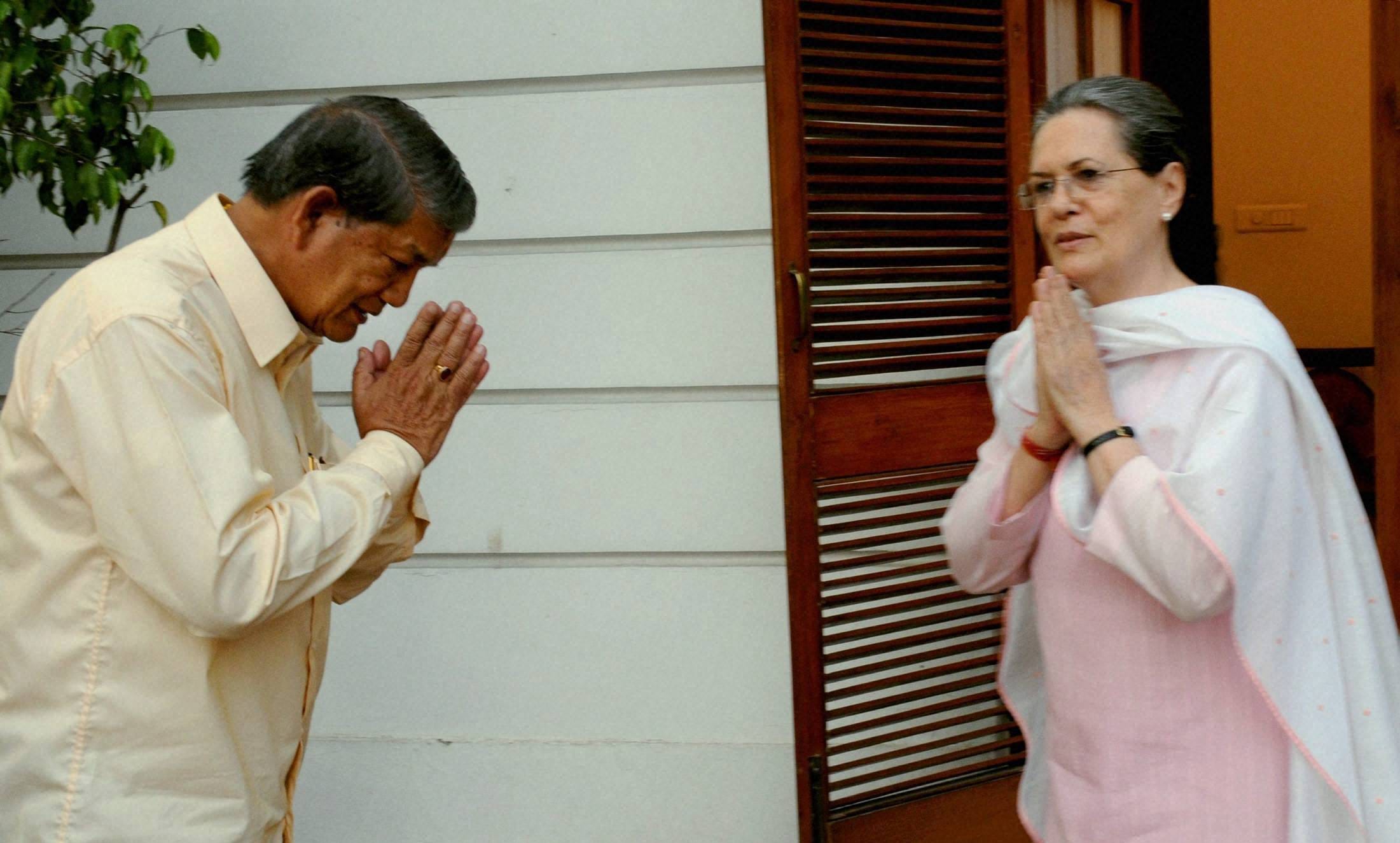 harish rawat met sonia gandhi after winning floor test.