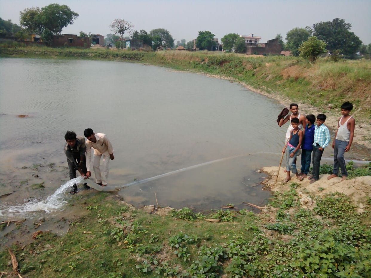Villagers in three ponds full of water