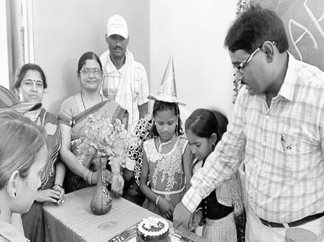 Schoolchildren celebrated birthday cake cutting