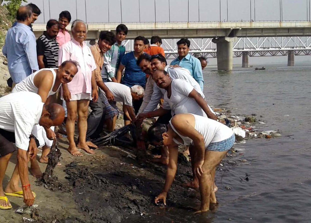 Young man cleaning the Ganga Mahasabha, All India kayastha