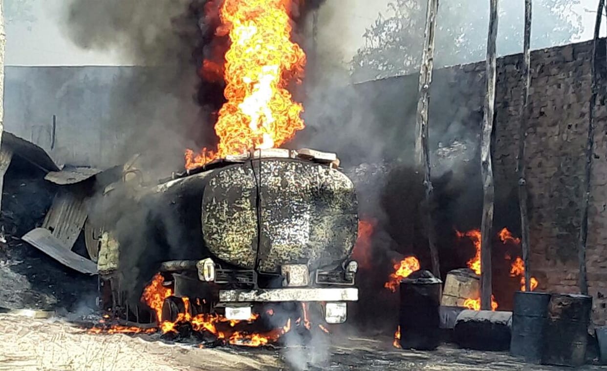 Tanker on fire four shops ash