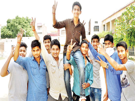 Aryan Tripathi top the district in high school 