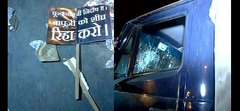 Supporters of Asaram protest in Delhi, vandalise police vehicle.More than five policemen injure