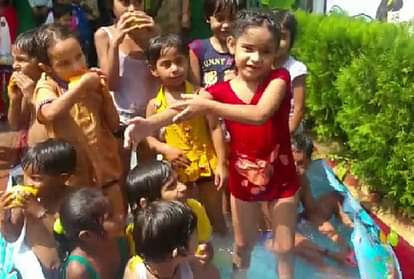 Childrens playing and dancing in water park