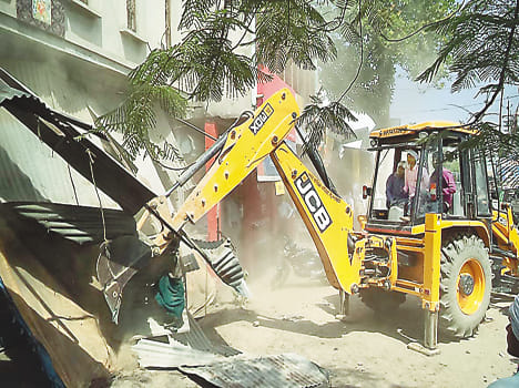 See bulldozers working shopper eviction