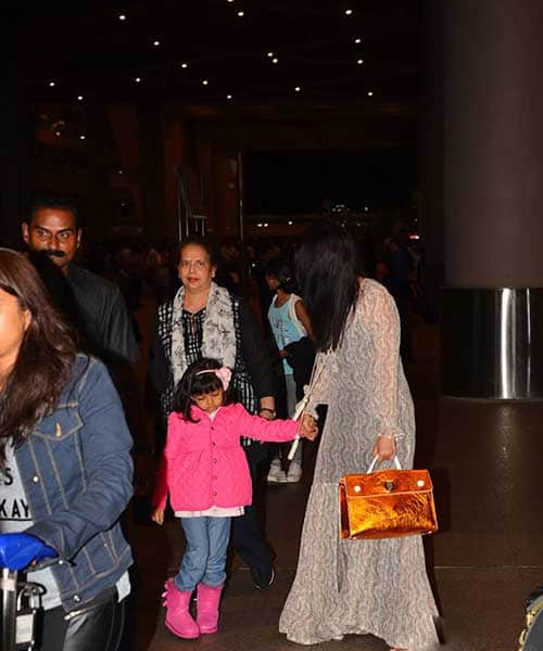 Aishwarya Rai returns from cannes with tired daughter