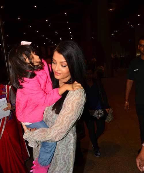 Aishwarya Rai returns from cannes with tired daughter