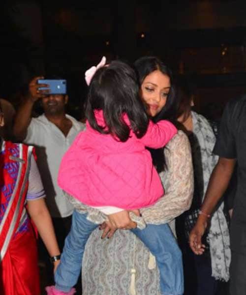 Aishwarya Rai returns from cannes with tired daughter