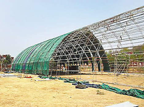 Pavilion audience against sun and water
