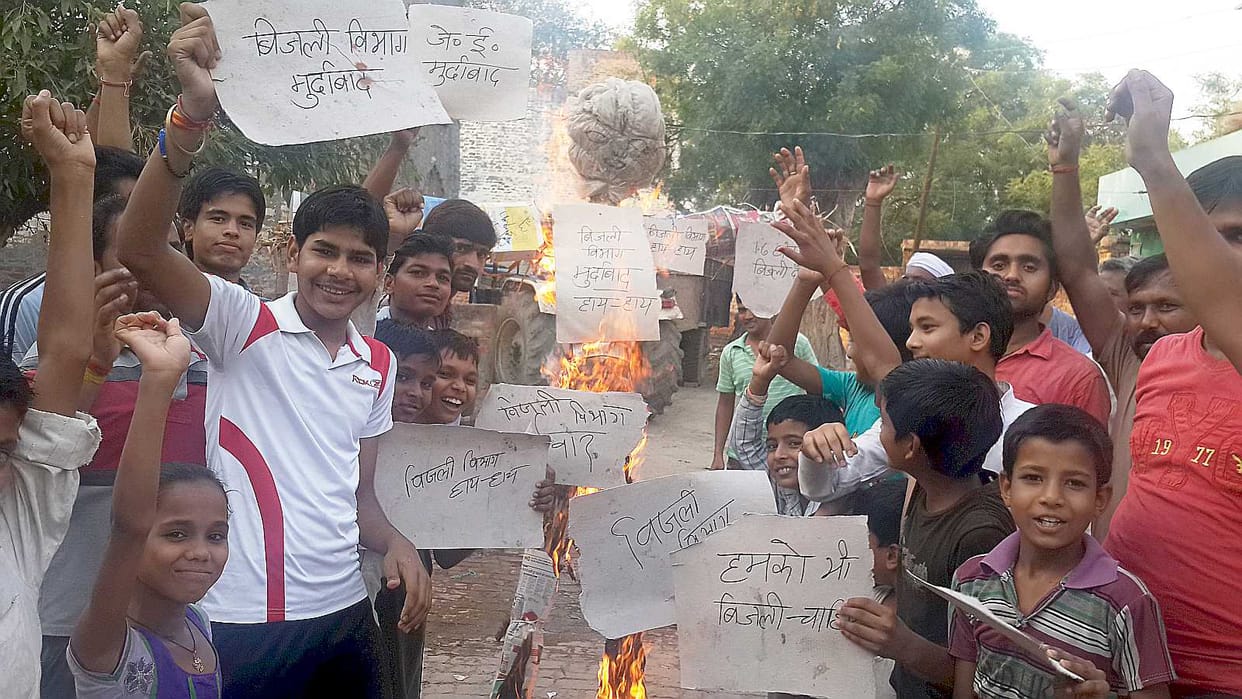 Electricity department burnt effigies of