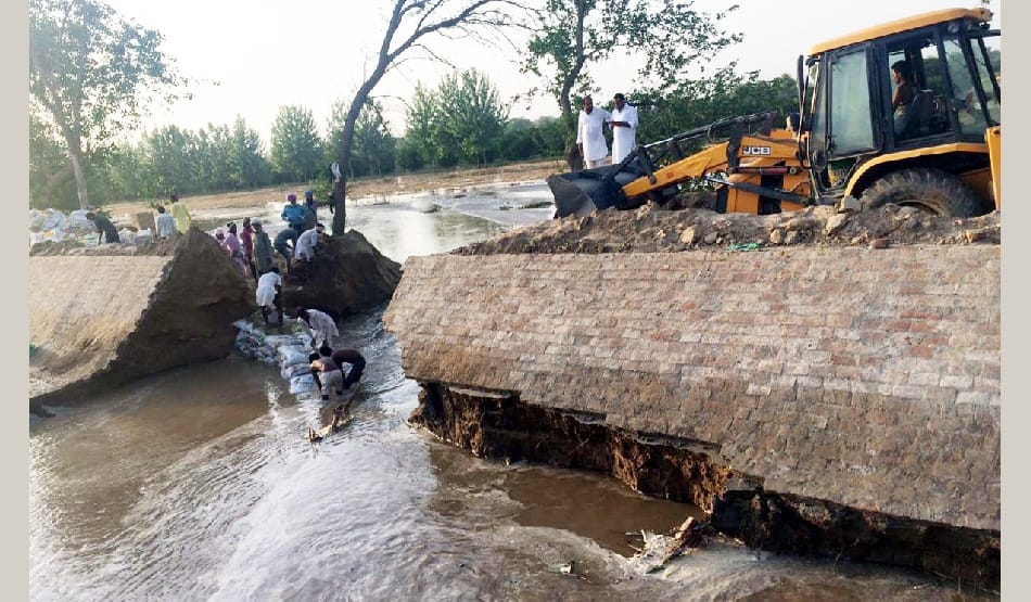 Broken main canal, submerged farmland
