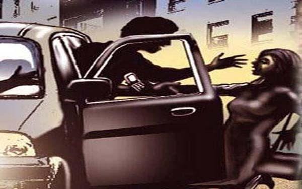 young girl pulled in car 