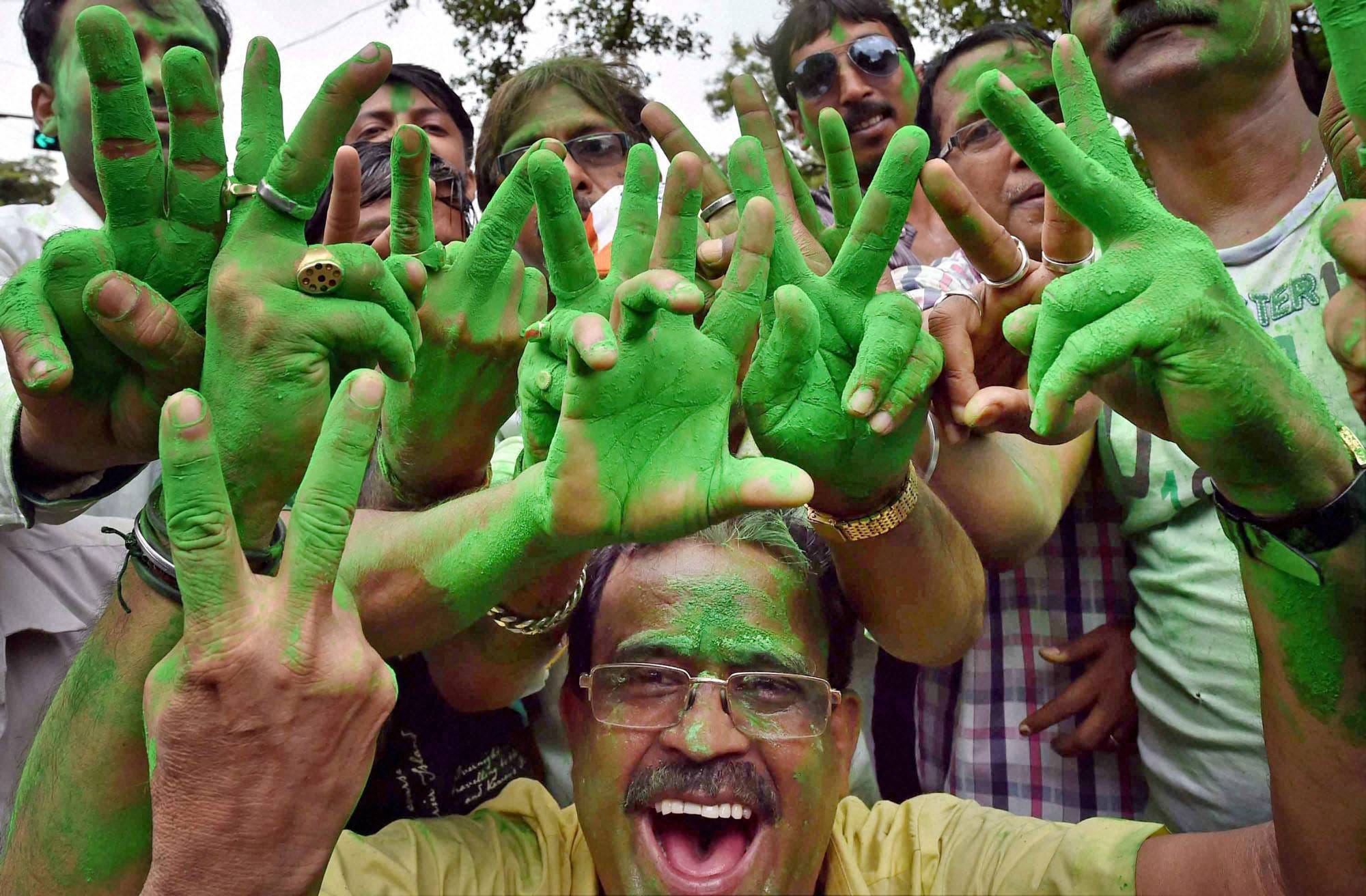 tmc and AIADMK supporters celibrate