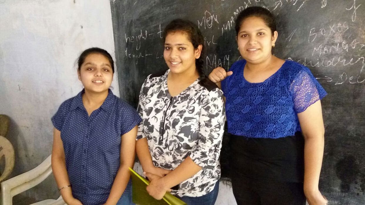 3 Girls spread education on poor children.