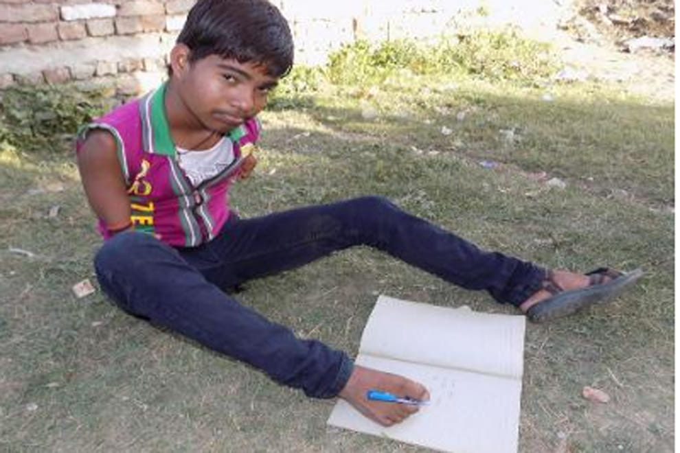 16-year-old armless boy in UP aces class X exams by writing with his feet