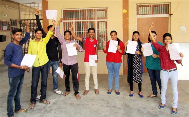 Sandeep in Science and kartik top in commerce