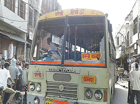 Bike rider young men broke the glass roadways bus