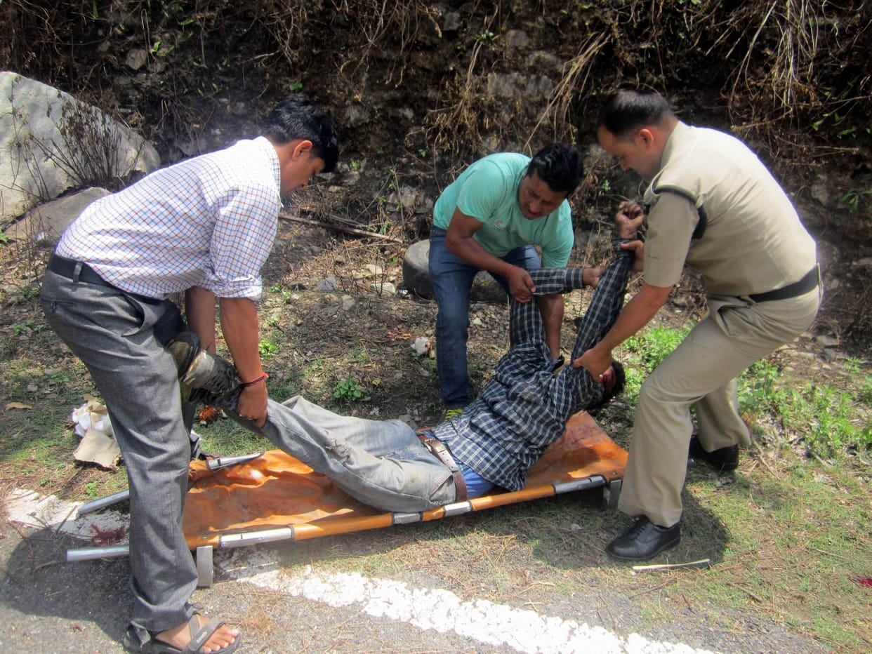 Trucks collide, injuring the driver and cleaner