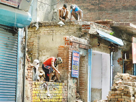 Bulldozers roar today with modest relief