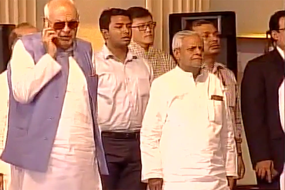 Farooq Abdullah talking on phone during the national anthem