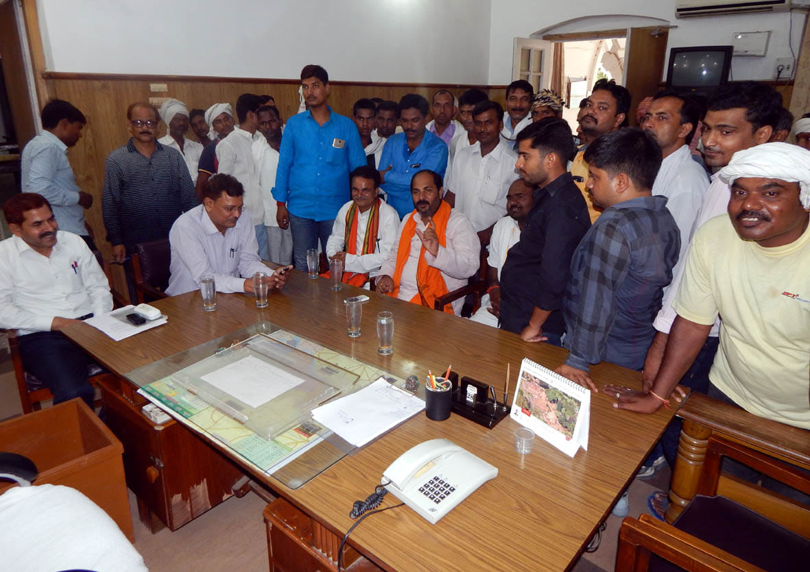 DM office flanked by legislators