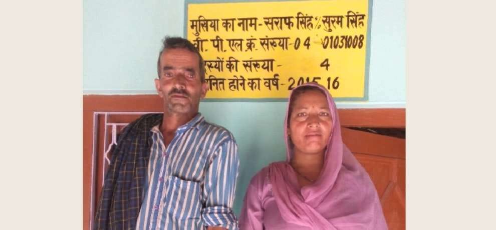 below poverty line sign board on a himachal family house