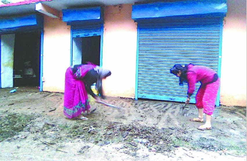 Removing debris from the rural courtyard