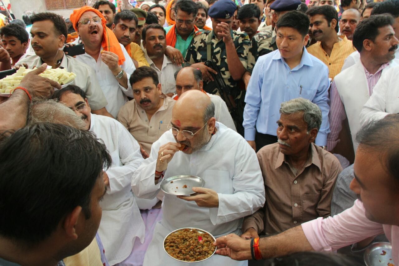 bharatiya janata party's president ami shah's lunch with dalits in varanasi uttar pradesh