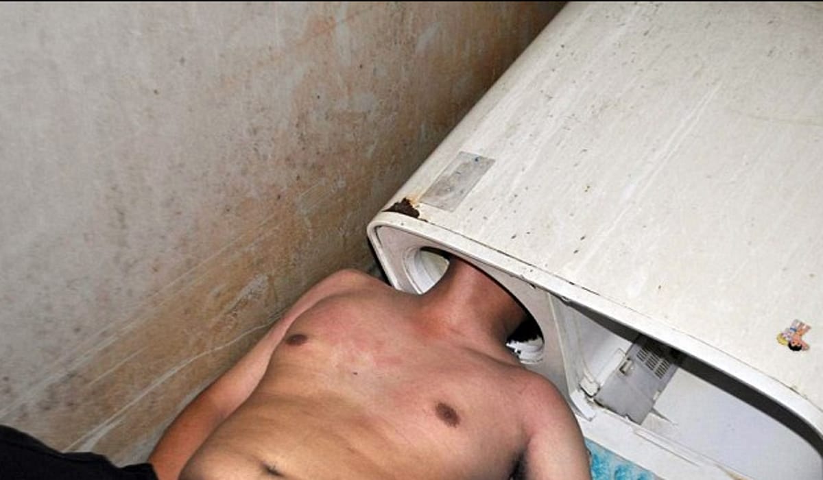  Chinese Man Tries To Fix Washing Machine, Gets His Head Stuck In It